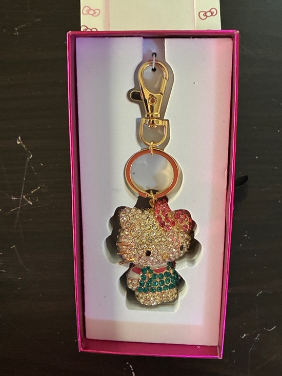 Hello Kitty Other - Hello Kitty Gold-Tone Crystal Keyring with Pink Bow and Teal Outfit